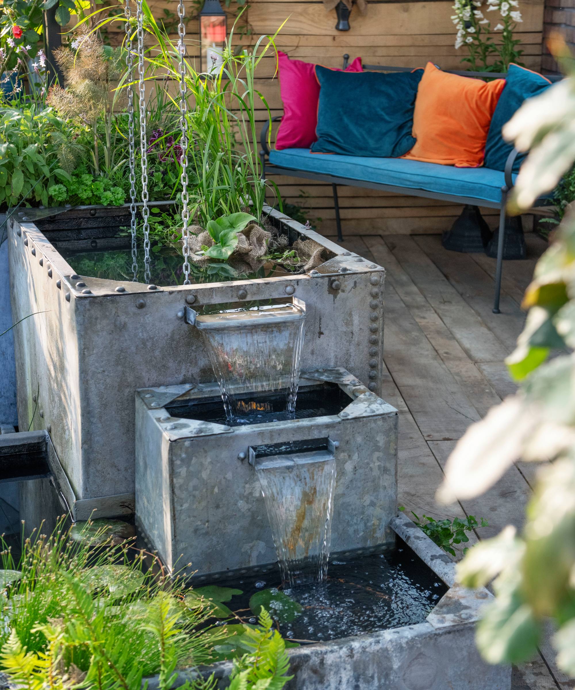 Rain chains feeding galvanised metal water feature