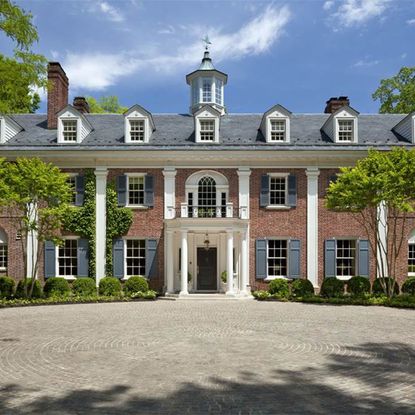 brick house with trees and windows