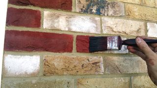 brick tinting being applied to a brick wall
