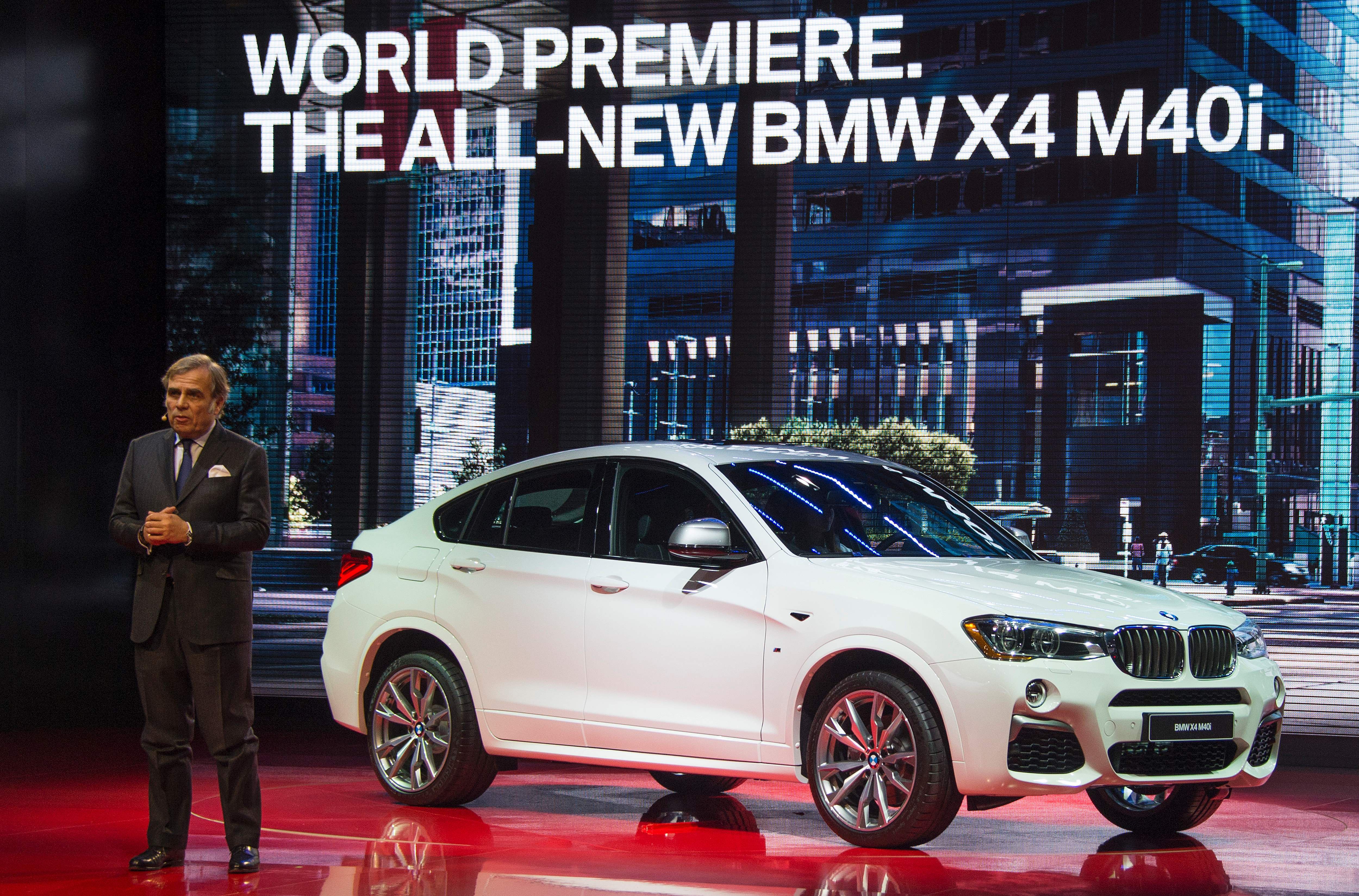 President of BMW North America Ludwig Willisch, unveils the BMW X4 M40i during the BMW press conference at the North American International Auto Show in Detroit, Michigan, January 11, 2016. A