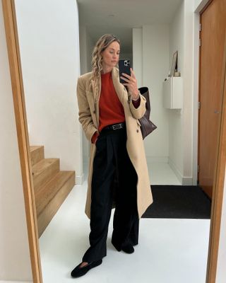 Fashion influencer @anoukyve wearing chic flat shoes that are on-trend for 2025.