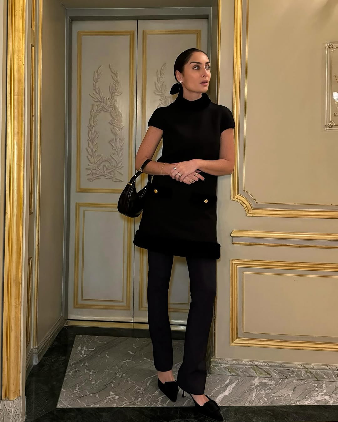 woman wearing flattering black pants with slight flare