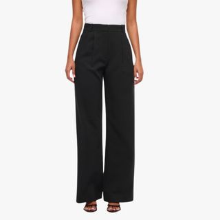 flat lay image of black wide leg trousers