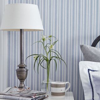 wallpaper on wall with lamp and paper