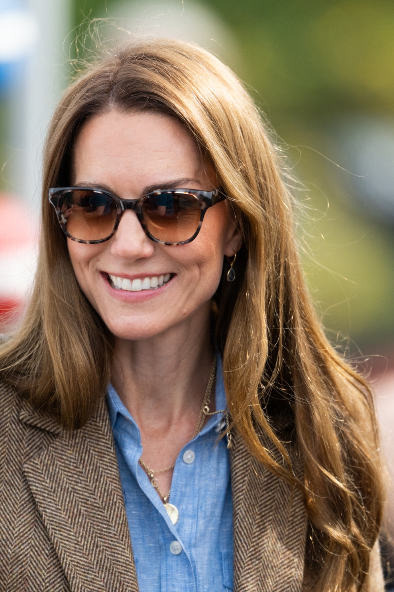 Catherine, Princess of Wales is pictured with glossy brown hair and wearing sunglasses during a visit to a local market on April 29, 2025 in Tobermory, Scotland.