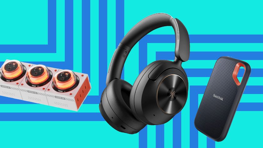 A Genki Moonbase charging station, OneOdio FOcus A6 headphones and a Sandisk Extreme SSD on a blue background