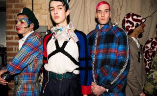 Three male models wearing clothing by Charles Jeffrey.