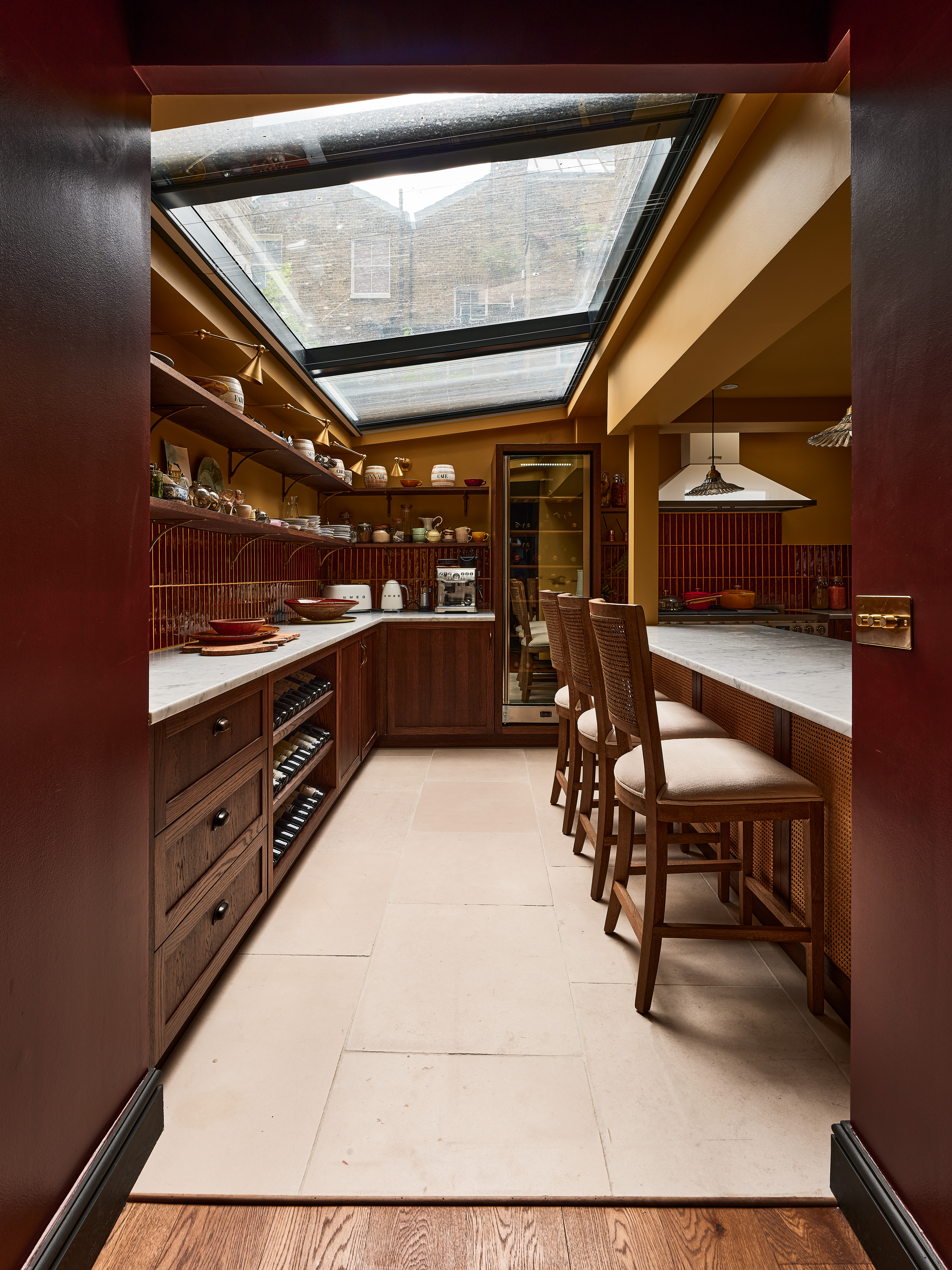 Kitchen with dark maroon tiles