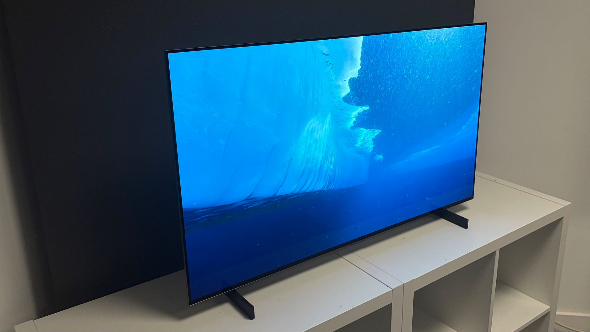LG C6 42-inch OLED TV on white shelving unit in test room