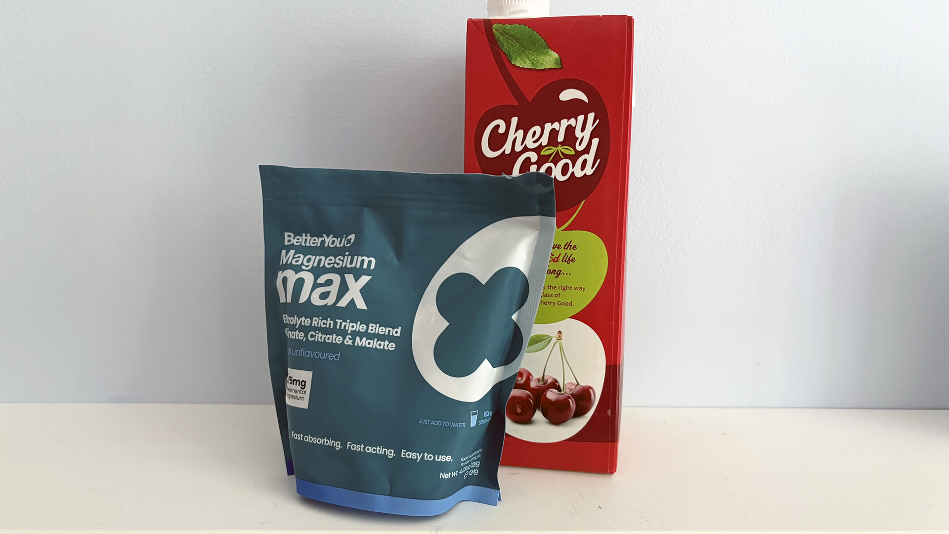 A carton of tart cherry juice and a packet of powdered magnesium