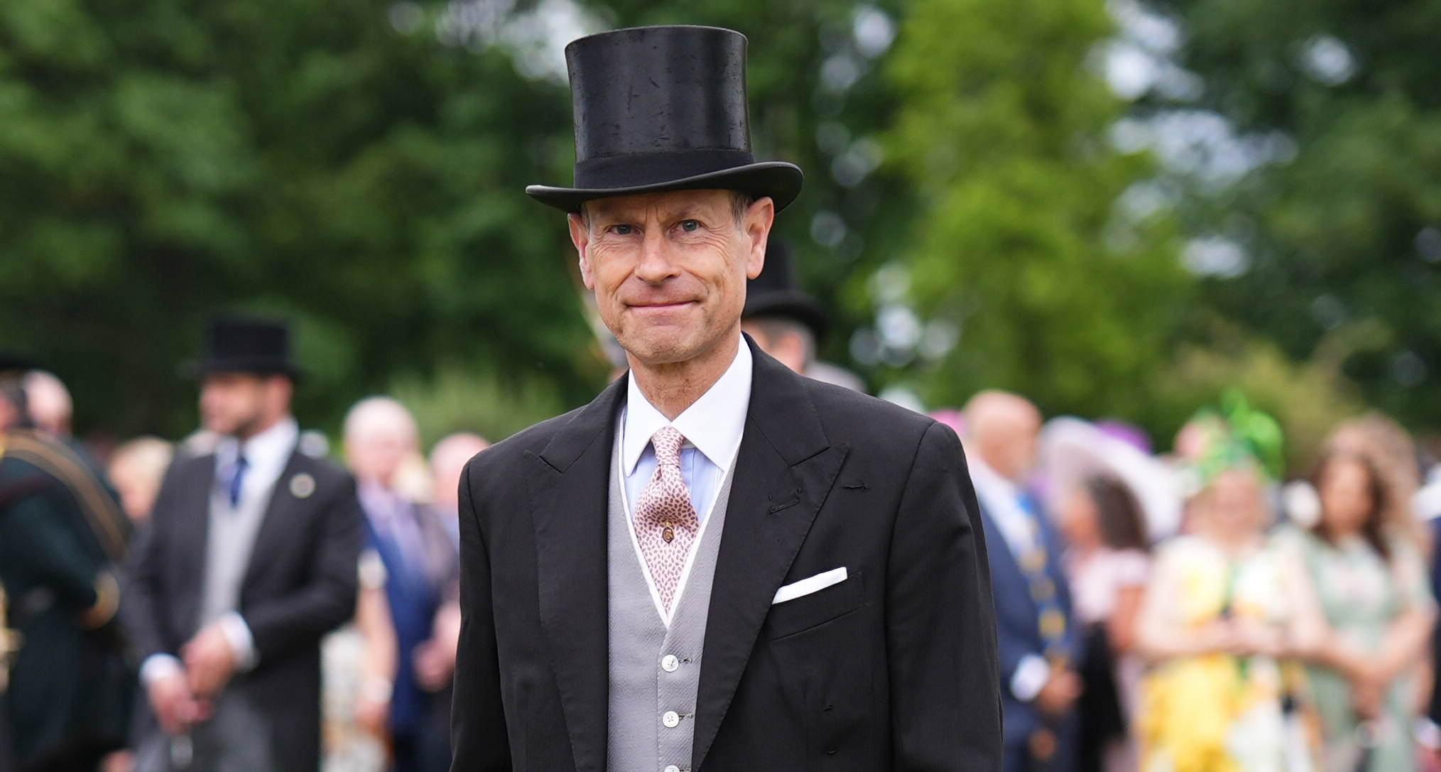 Prince Edward wearing a suit and top hat