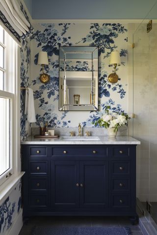 A bathroom with wallpaper