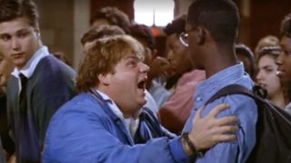 Tommy grabbing a guy by the shoulders in Tommy Boy.