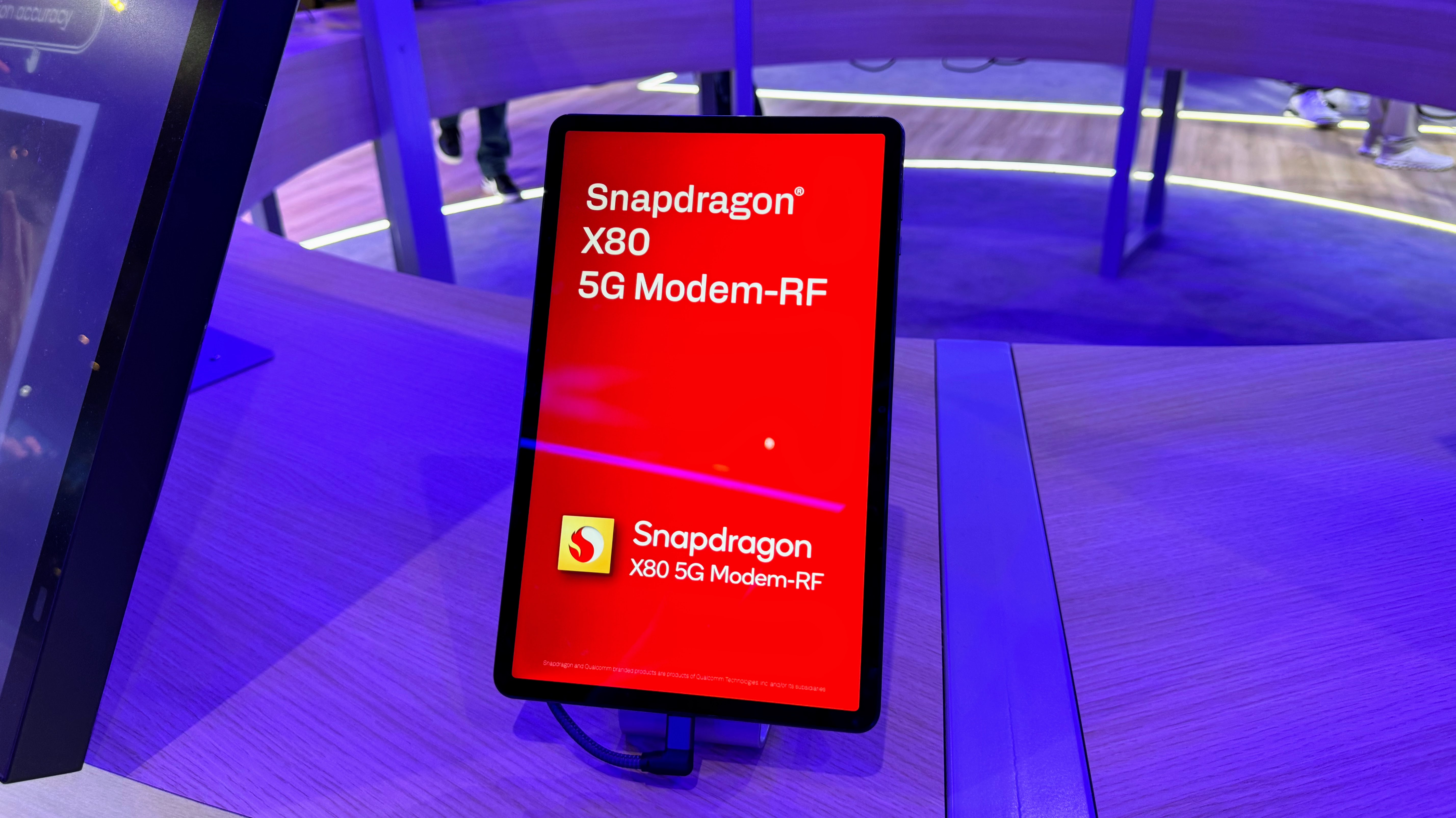 A photo of a graphic touting the Qualcomm Snapdragon X80 modem chip
