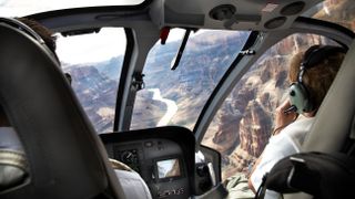 Pilots in a Helicopter over the Grand Canyon
