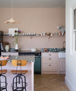 Kitchen walls in Setting Plaster and cabinets in Templeton Pink, both from Farrow & Ball