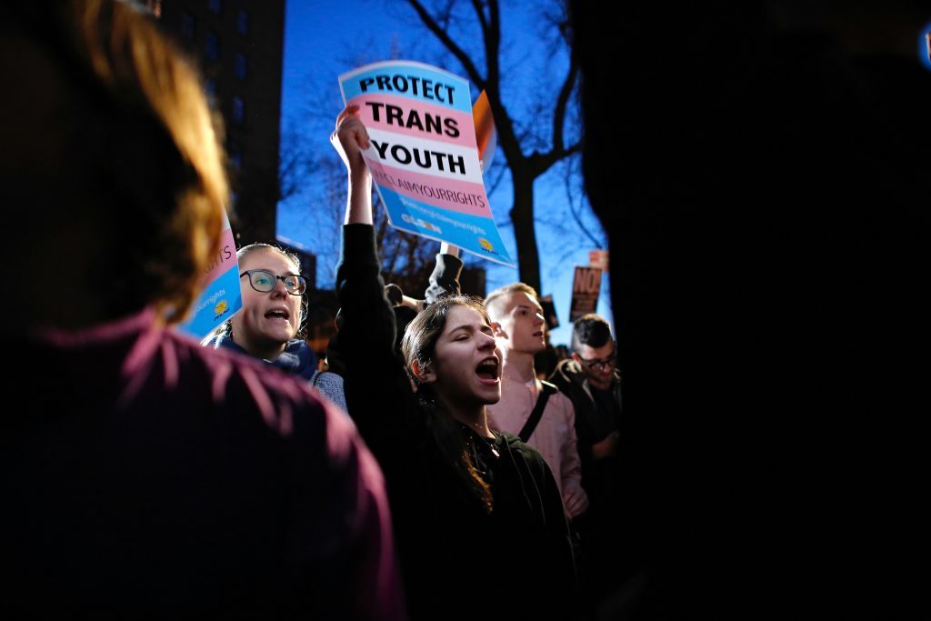 Protesters marching for trans rights.