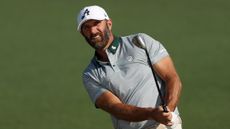 Dustin Johnson takes a shot during a practice round at The Masters 