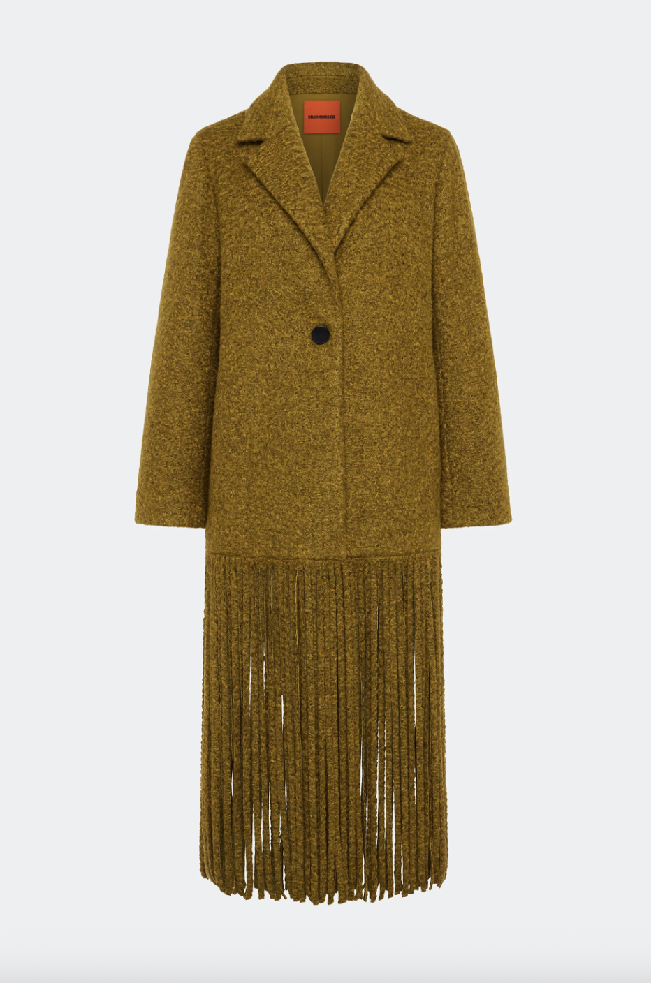 a simon miller fringe coat on a plain backdrop