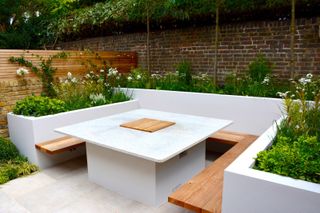 bespoke outdoor dining table with a gas fit built into the centre