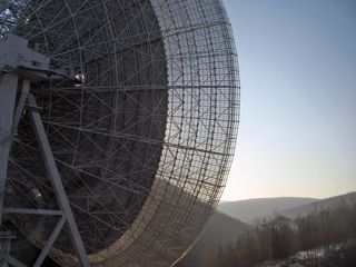 This image shows the Effelsberg radio telescope during regular observations of the Galactic Center region for unidentified pulsars. The Galactic Center is in the Sagittarius constellation and is only visible for approximately 2 hours and 25 minutes every day. Image released Aug. 14, 2013.