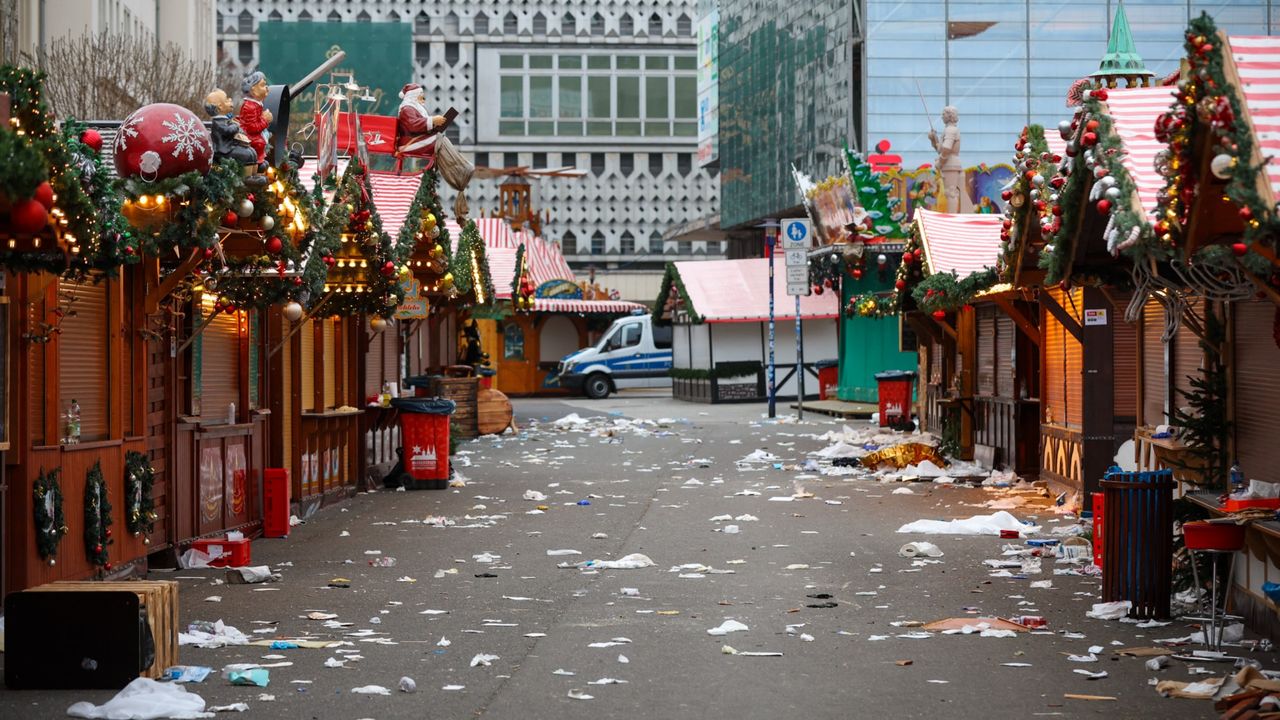 Debris and closed stalls are seen on the site of a car-ramming attack on a Christmas market in Magdeburg, eastern Germany