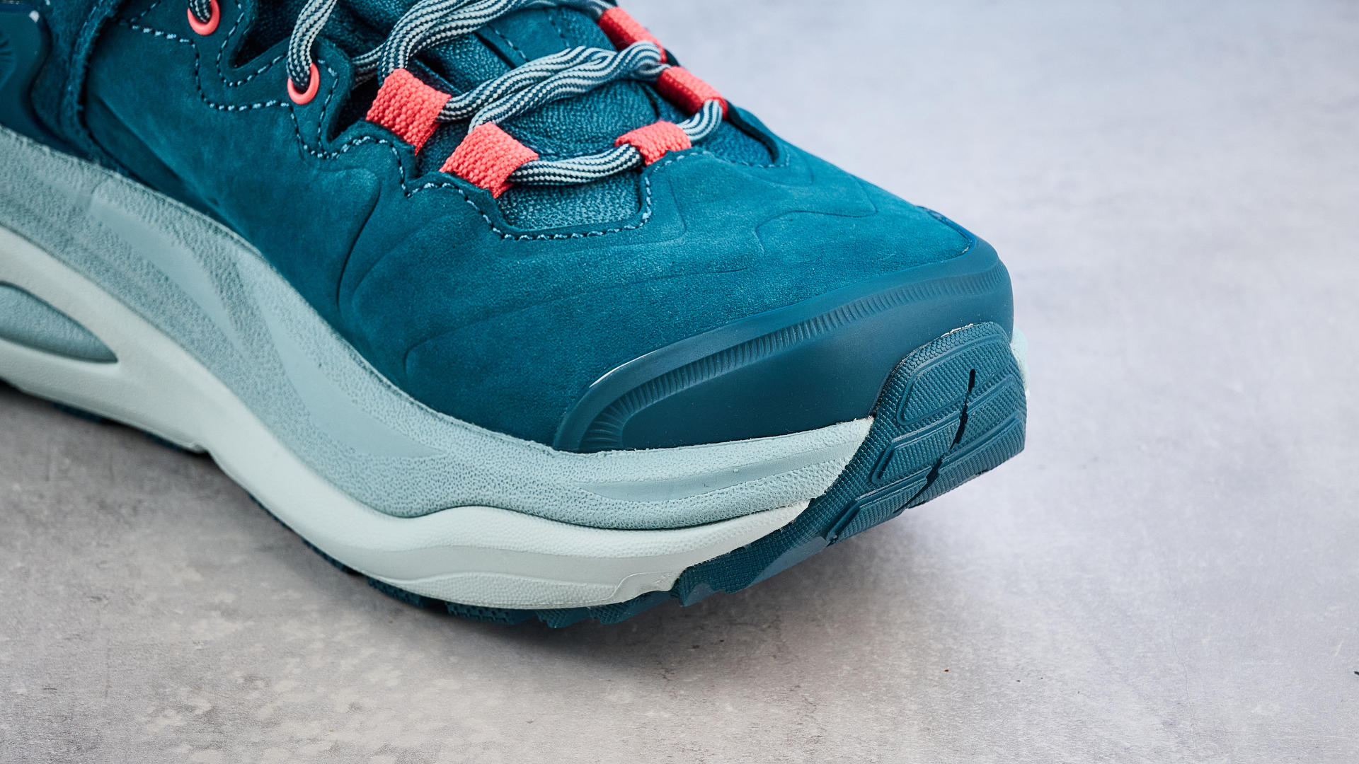 Hoka Kaha 3 Low GTX in droplet colorway photographed in front of a blue background