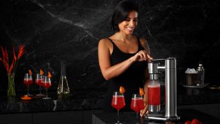 Woman using the Breville InFizz Fusion