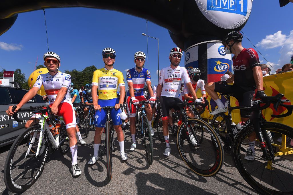 KRAKOW POLAND AUGUST 09 Start Patryk Stosz of Poland and Team Poland Polka Dot Mountain Jersey Remco Evenepoel of Belgium and Team Deceuninck QuickStep Yellow Leader Jersey Maciej Paterski of Poland and Team Poland Blue Most Active Rider Jersey Diego Ulissi of Italy and UAE Team Emirates White Best Young Jersey during the 77th Tour of Poland 2020 Stage 5 a 188km stage from Zakopane to Krakow TourdePologne tdp20 on August 09 2020 in Krakow Poland Photo by Luc ClaessenGetty Images