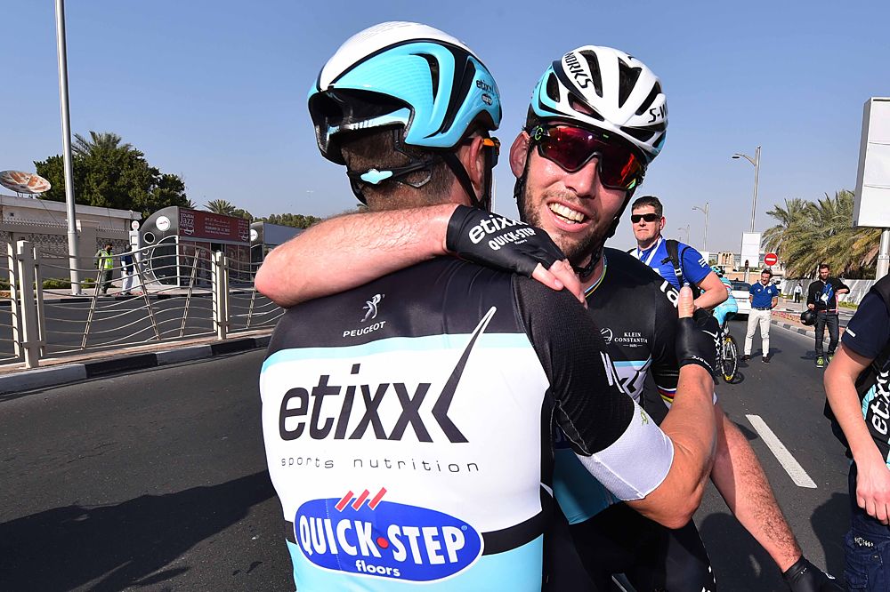 Cavendish congratulated by teammates at the finish line in Dubai