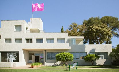 The Hyères International Festival of Fashion and Photography returns to the iconic Villa Noailles. A neon pink flag flies at full mast to mark the occasion
