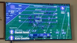 Stats are overlaid on screen during a football game on YouTube TV