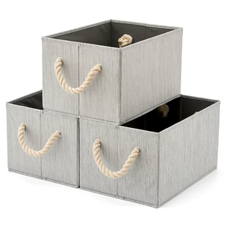Three grey fabric storage boxes stacked together