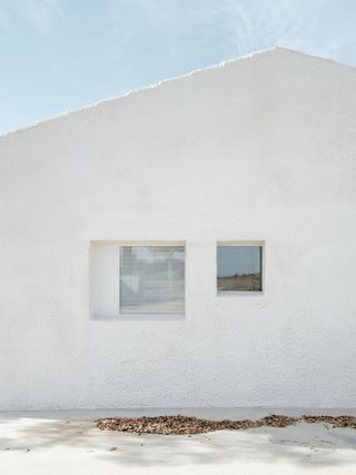 white exterior facade in spanish house