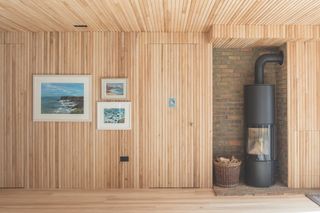 interior timber cladding with woodburning stove