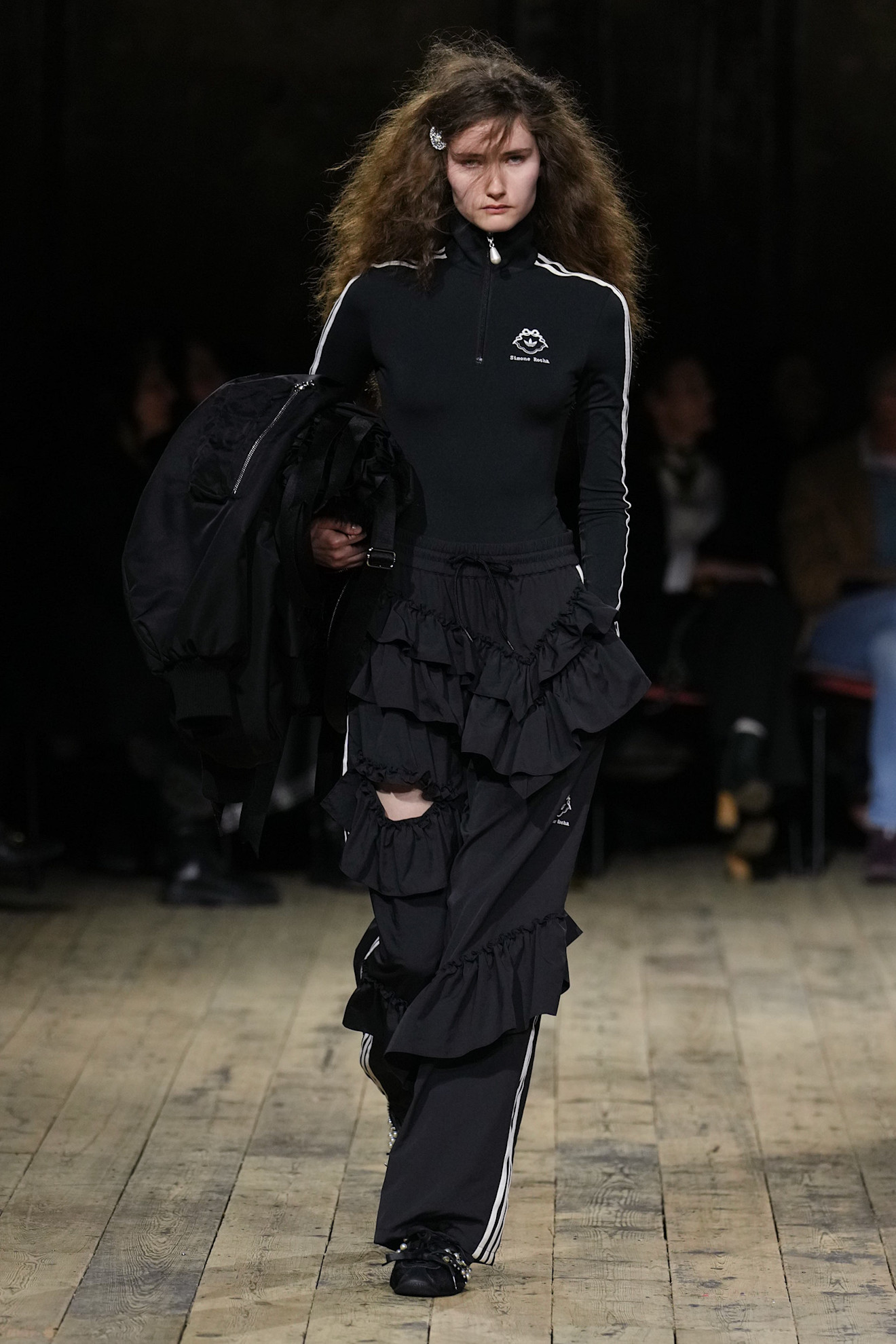 a model wearing simone rocha x adidas on the simone rocha runway