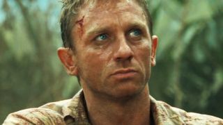 Daniel Craig glares angrily in the field in Casino Royale.