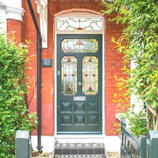 green ornate edwardian style front door with decorative glazing