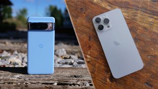 Google Pixel 8 Pro on railroad tracks in a split view with iPhone 15 Pro Max on a wood table