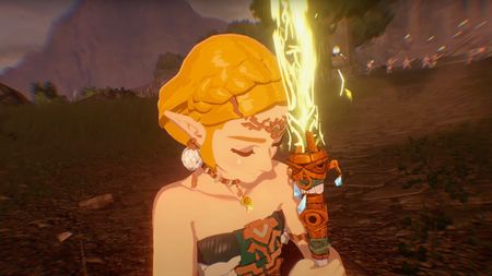 A screenshot shows Zelda closing her eyes as she holds a Zonaite sword