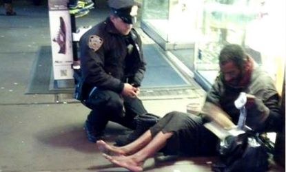 One of New York's finest gives a pair of boots to a homeless man in Times Square.