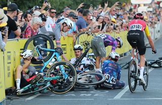 ADELAIDE AUSTRALIA JANUARY 18 riders from multiple teams on the ground after a crash on the last corner of the race during day two of the Tour Down Under on January 18 2025 in Adelaide Australia Photo by Sarah ReedGetty Images