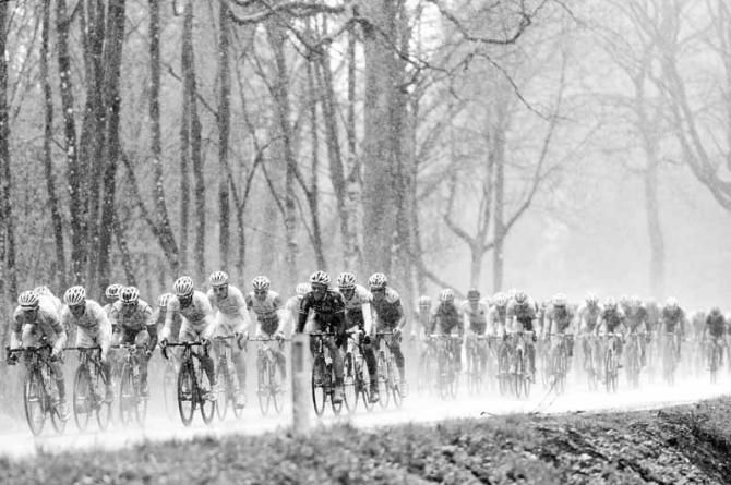 The peloton battered by a hail storm early on at Liege-Bastogne-Liege