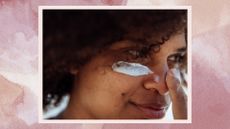 Image of a woman applying sunscreen to face with a pink watercolour background