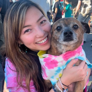 Sarah and Duke wearing matching tie dye tops