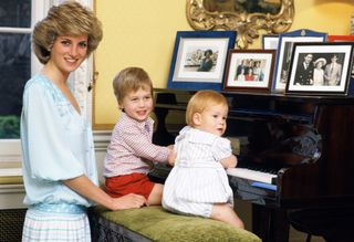Diana, Princess of Wales with her sons, Prince William and Prince Harry, at the piano in Kensington Palace
