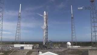 SpaceX's Falcon 9 rocket stands poised to launch a Dragon spacecraft from Cape Canaveral Air Force Station in Florida on April 13, 2015 on a mission to deliver NASA cargo to the International Space Station. It is SpaceX's sixth cargo mission for NASA.