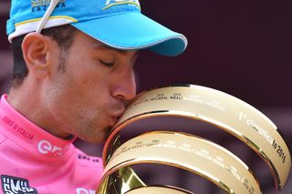 Vinceno Nibali plants a kiss on the trophy