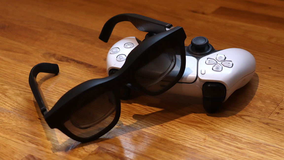 Nreal Air AR glasses; a pair of black AR glasses on a PS5 Dualsense controller