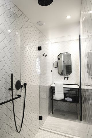 The striking black and white-tiled bathrooms